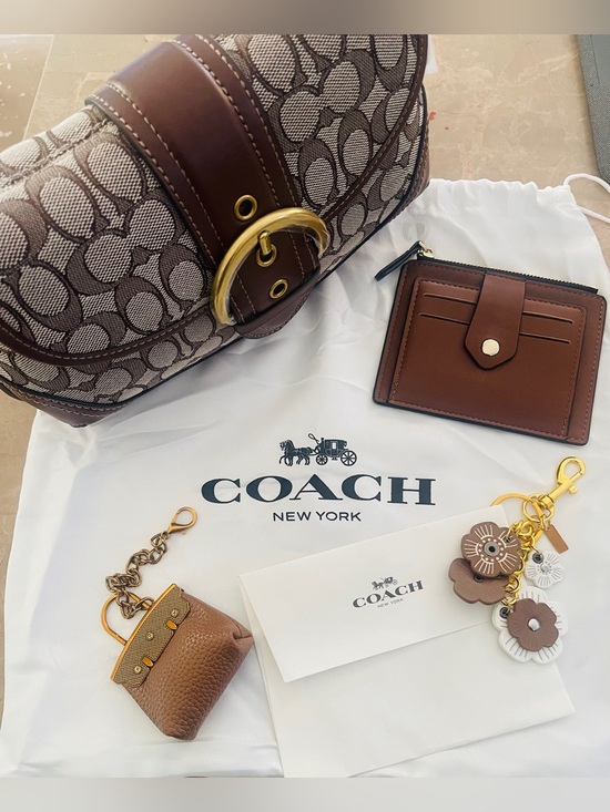 Coach Handbags - Coach soho Brown Signature Canvas with Leather .